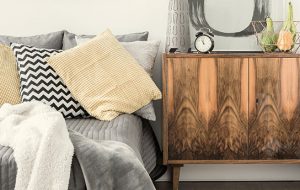 Alarm Clock on rustic end table near bed