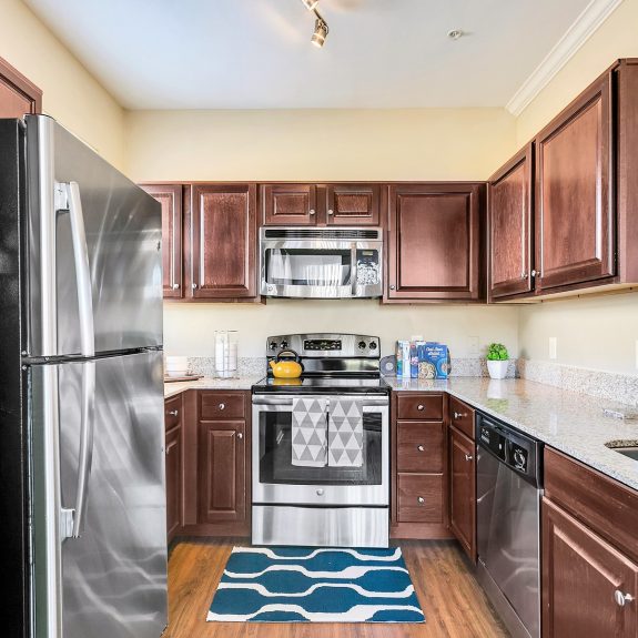 Kitchen with finished kitchen cabinets and stainless steel appliances