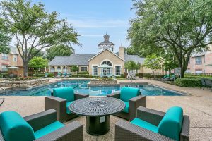 Vine South Pool Lounging Area with fireplace table