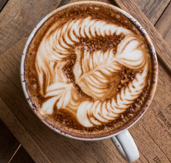 Closeup of a fancy latte with cream art