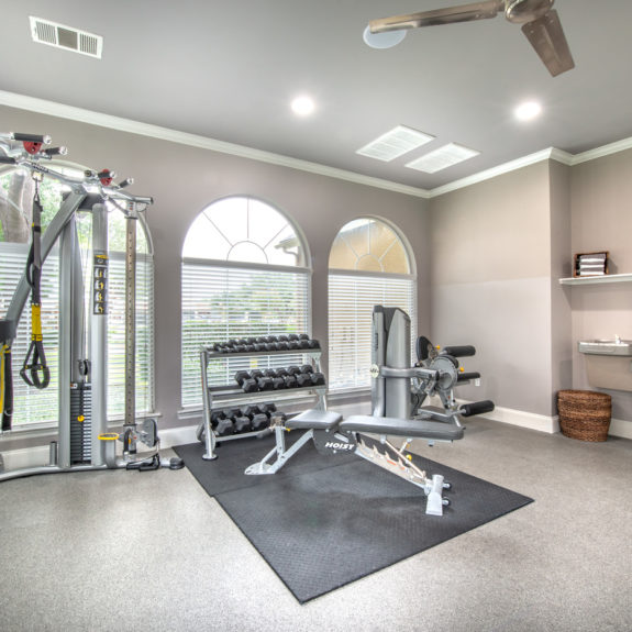 Fitness area with water fountains, free weights and lifting equipment