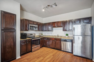 Open kitchen with granite counter tops and stainless steel appliances