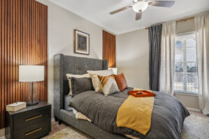 Bedroom with Large window and ceiling fan